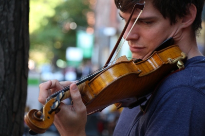 Aubrey Holmes, 25, began to play on Newbury St. since two summer ago. He got his Master of Music degree in violin performance at the Boston Conservatory last year. His violin playing career started at the age of four.